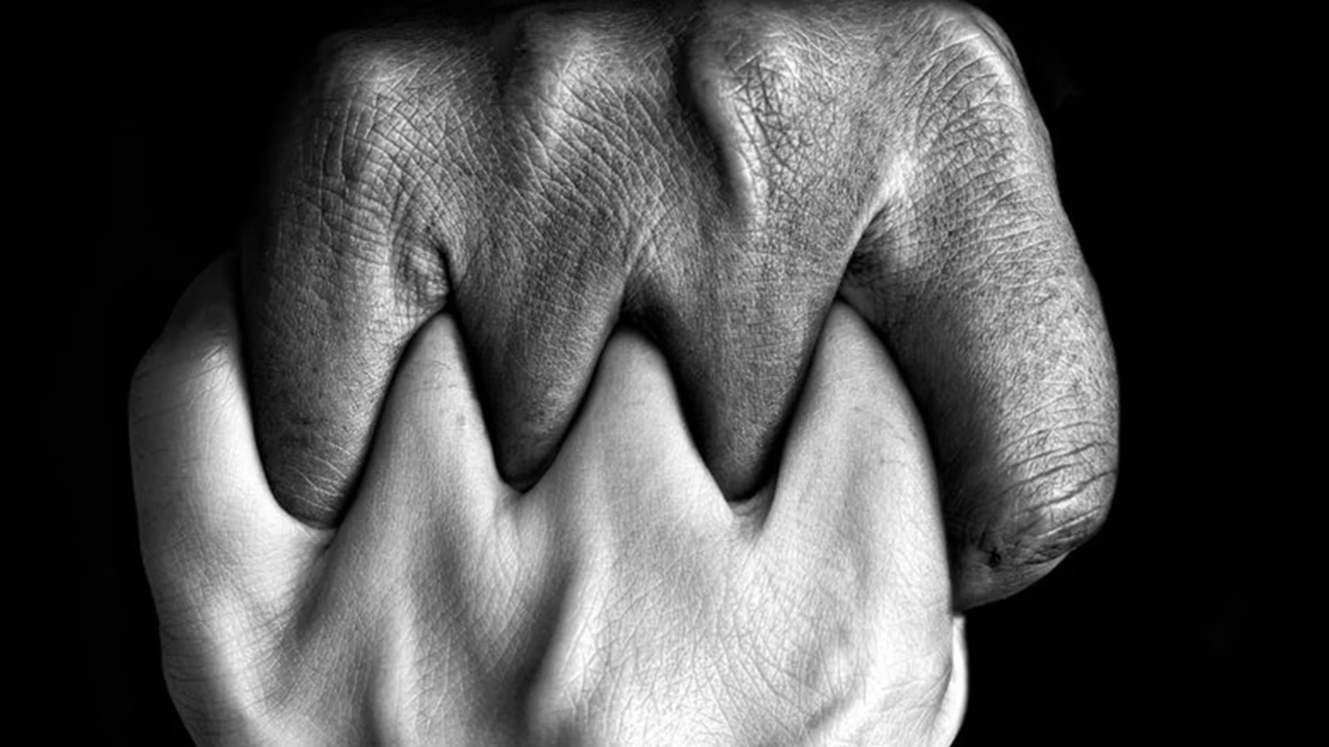 Hands meeting in a gesture of connection